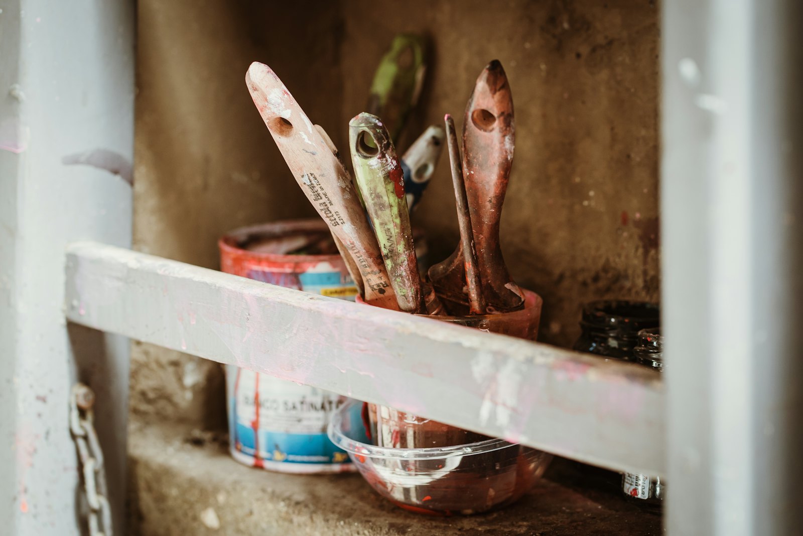 Used brushes in a jar